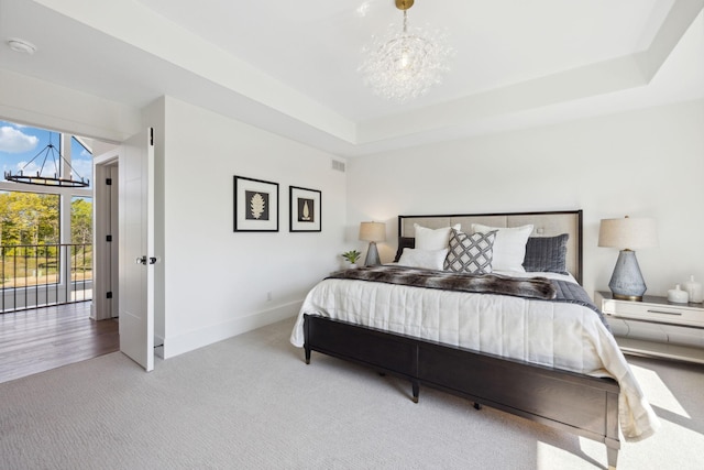 bedroom with carpet floors, baseboards, an inviting chandelier, and visible vents