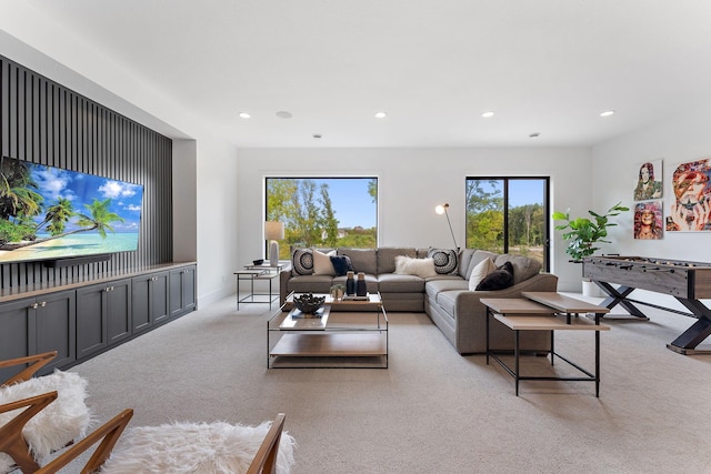 living room featuring recessed lighting and carpet