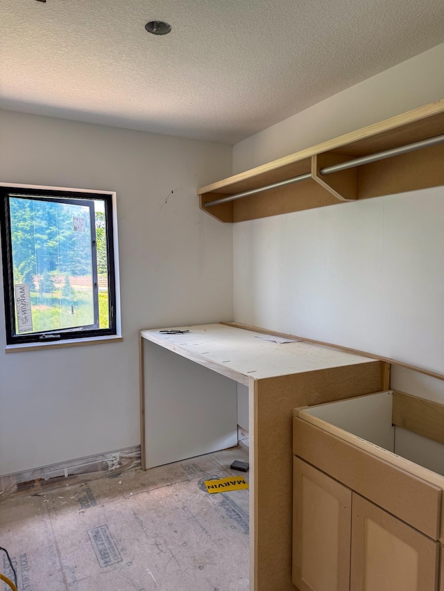 705 Ensconced Way, Chaska, MN 55318 - laundry room with a textured ceiling and baseboards
