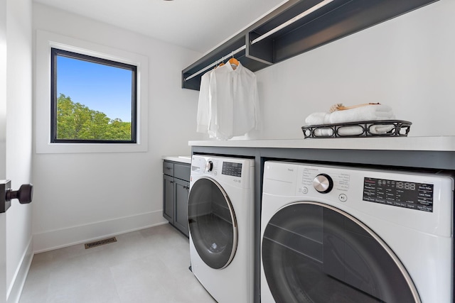 705 Ensconced Way, Chaska, MN 55318 - laundry area featuring separate washer and dryer, cabinet space, and light flooring