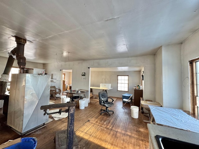 office area featuring a sink and wood-type flooring