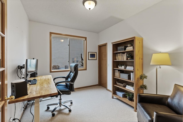 office with baseboards, carpet, and a textured ceiling