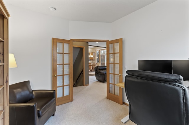 office area featuring light carpet and french doors