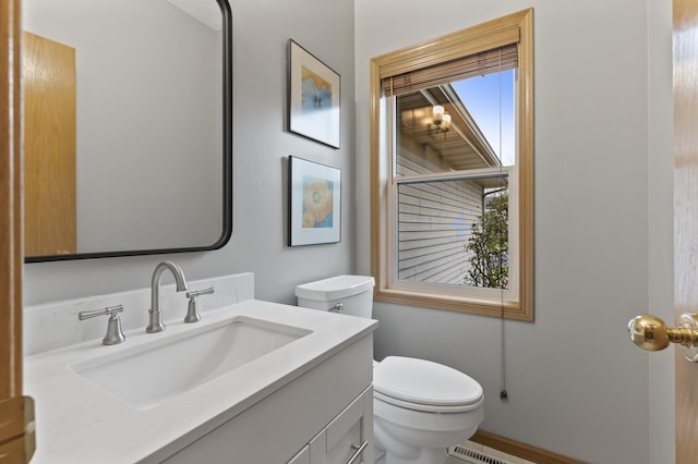 bathroom with toilet and vanity