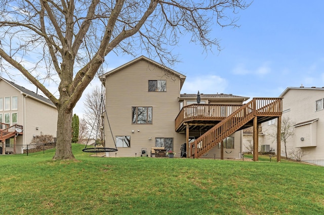 back of house with a lawn, central AC, a deck, and stairway