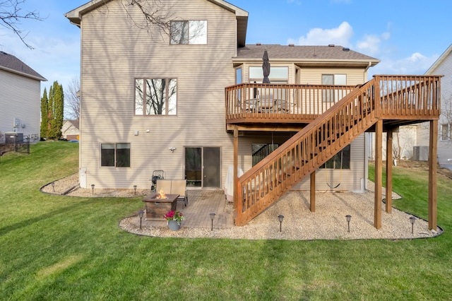back of house with a fire pit, a wooden deck, a patio, central AC unit, and stairway