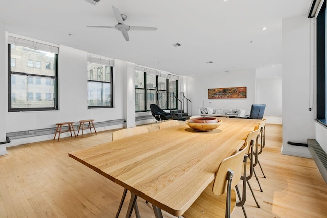 290 Market St Unit 314, Minneapolis, MN 55405 - dining area with a ceiling fan, light wood-style floors, and a healthy amount of sunlight