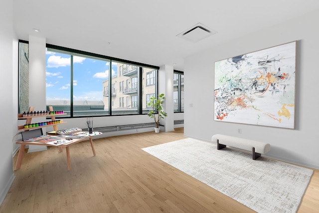 290 Market St Unit 314, Minneapolis, MN 55405 - sitting room featuring visible vents, wood finished floors, and baseboards