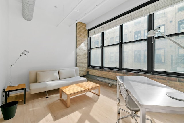 290 Market St Unit 314, Minneapolis, MN 55405 - interior space featuring wood finished floors and brick wall