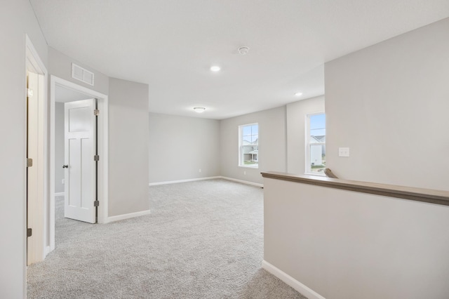 interior space with visible vents, baseboards, recessed lighting, and carpet flooring