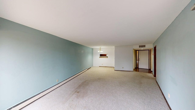2495 Canabury Dr Unit 125, Little Canada, MN 55117 - empty room featuring baseboard heating, light colored carpet, and visible vents