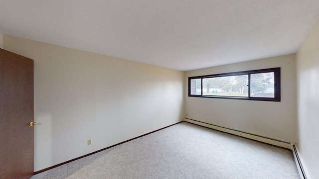 2495 Canabury Dr Unit 125, Little Canada, MN 55117 - spare room featuring a baseboard radiator, light colored carpet, and baseboards