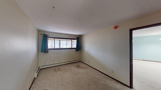 2495 Canabury Dr Unit 125, Little Canada, MN 55117 - carpeted empty room featuring a baseboard radiator and baseboards