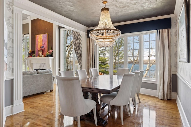 6425 Virginia Dr, Victoria, MN 55331 - dining room with a chandelier, healthy amount of natural light, wood finished floors, and ornamental molding