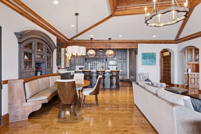 6425 Virginia Dr, Victoria, MN 55331 - dining room featuring a chandelier, light wood-type flooring, arched walkways, recessed lighting, and ornamental molding