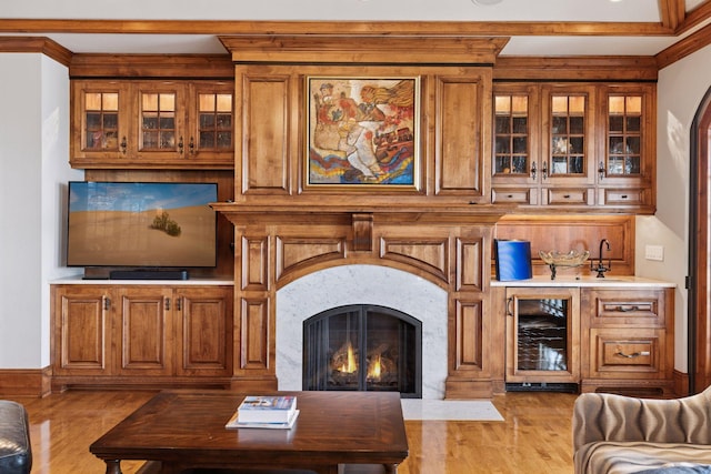 6425 Virginia Dr, Victoria, MN 55331 - living room with beverage cooler, a fireplace, and light wood finished floors