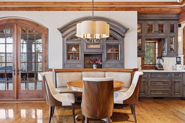 6425 Virginia Dr, Victoria, MN 55331 - dining space featuring a chandelier, light wood-type flooring, french doors, and healthy amount of natural light