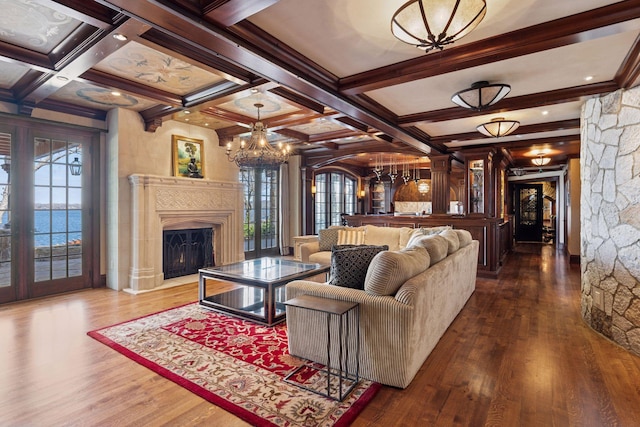 6425 Virginia Dr, Victoria, MN 55331 - living room with healthy amount of natural light, a chandelier, coffered ceiling, wood finished floors, and beamed ceiling