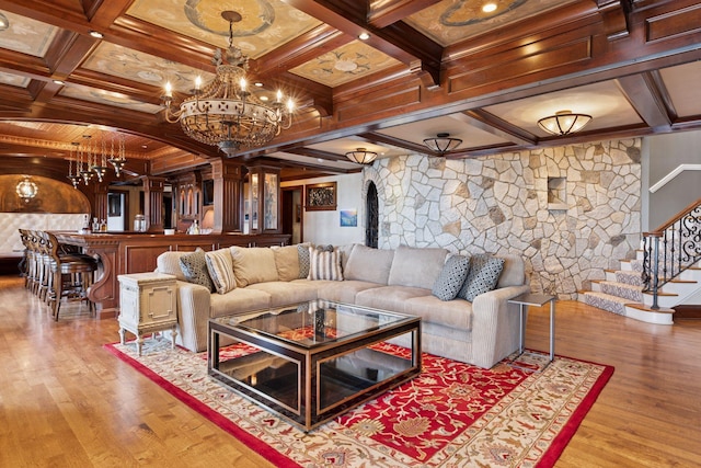 6425 Virginia Dr, Victoria, MN 55331 - living area featuring wood finished floors, coffered ceiling, beam ceiling, stairs, and a chandelier