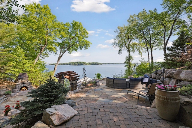 6425 Virginia Dr, Victoria, MN 55331 - view of patio / terrace featuring a water view and an outdoor living space with a fireplace