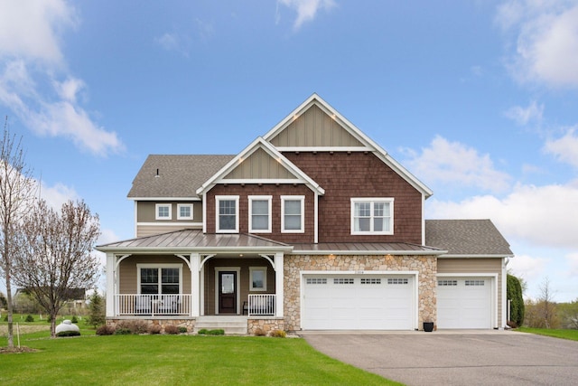 21804 Majestic Dr, Saint Augusta, MN 55320 - craftsman house featuring a front lawn, covered porch, driveway, and a standing seam roof