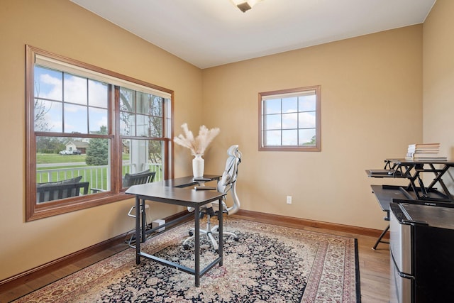 21804 Majestic Dr, Saint Augusta, MN 55320 - office space featuring light wood-type flooring, baseboards, and a wealth of natural light