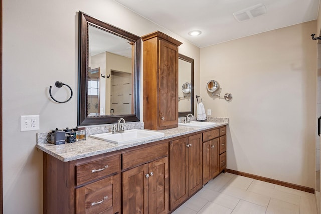 21804 Majestic Dr, Saint Augusta, MN 55320 - bathroom with a sink, tile patterned floors, double vanity, and visible vents