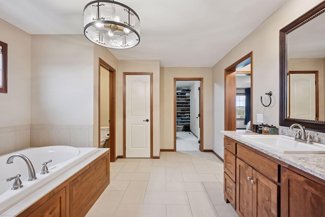 21804 Majestic Dr, Saint Augusta, MN 55320 - full bathroom featuring vanity, baseboards, a bath, and toilet