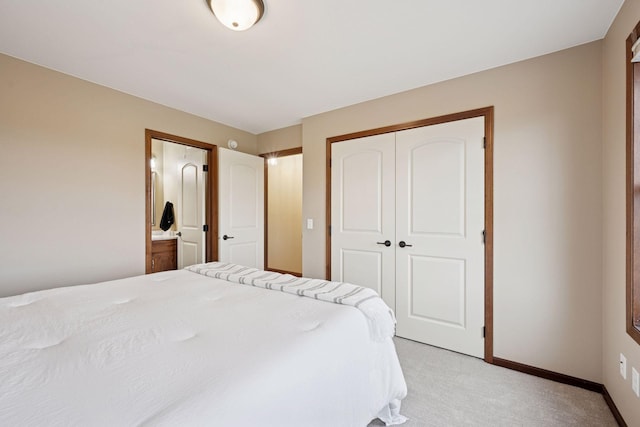 21804 Majestic Dr, Saint Augusta, MN 55320 - bedroom with baseboards, light carpet, a closet, and connected bathroom