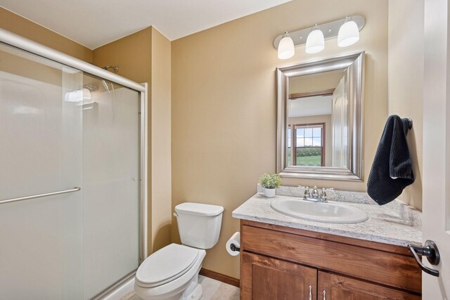 21804 Majestic Dr, Saint Augusta, MN 55320 - full bathroom with vanity, baseboards, toilet, and a shower stall