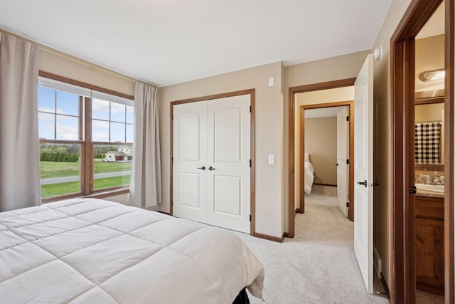 21804 Majestic Dr, Saint Augusta, MN 55320 - bedroom featuring baseboards, light colored carpet, and a closet