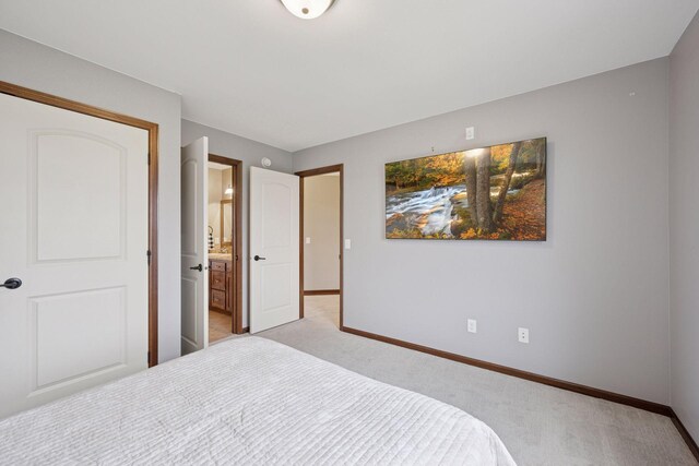 21804 Majestic Dr, Saint Augusta, MN 55320 - bedroom featuring baseboards, light colored carpet, and ensuite bathroom