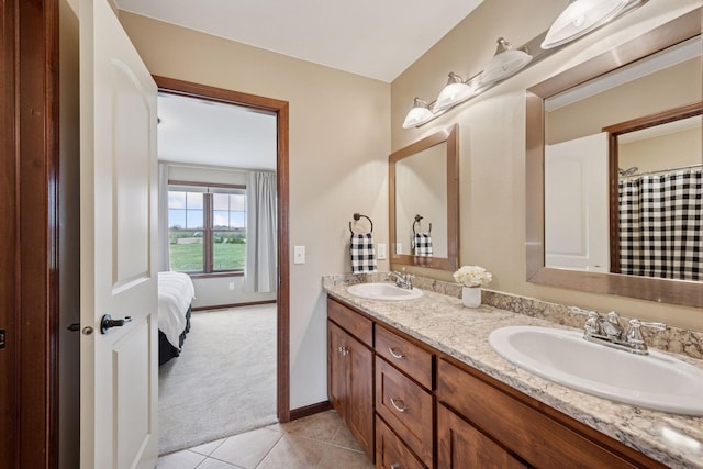 21804 Majestic Dr, Saint Augusta, MN 55320 - bathroom featuring double vanity, a sink, baseboards, and tile patterned floors