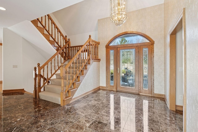 4 Antrim Ter, Edina, MN 55439 - entrance foyer featuring marble finish floor, baseboards, an inviting chandelier, and stairs