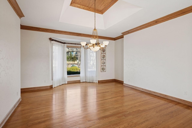 4 Antrim Ter, Edina, MN 55439 - unfurnished room featuring a tray ceiling, light wood-type flooring, a notable chandelier, and baseboards