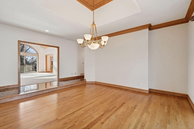 4 Antrim Ter, Edina, MN 55439 - spare room featuring light wood-style flooring, baseboards, and an inviting chandelier