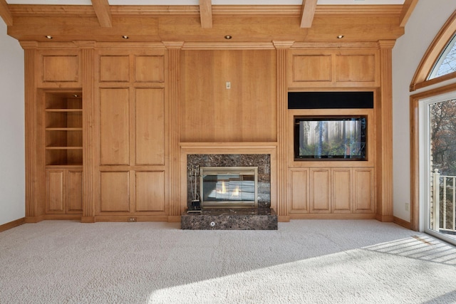 4 Antrim Ter, Edina, MN 55439 - unfurnished living room featuring light carpet, a high end fireplace, and beamed ceiling