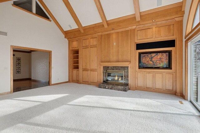 4 Antrim Ter, Edina, MN 55439 - unfurnished living room featuring built in features, a fireplace, beamed ceiling, high vaulted ceiling, and carpet flooring
