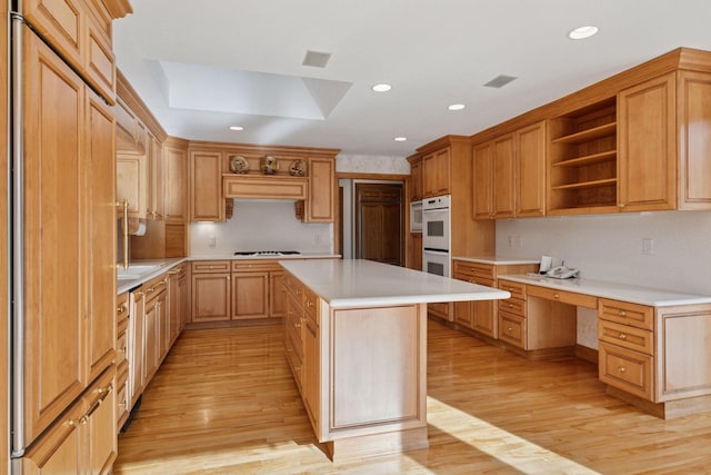 4 Antrim Ter, Edina, MN 55439 - kitchen with built in desk, light wood-type flooring, light countertops, and open shelves