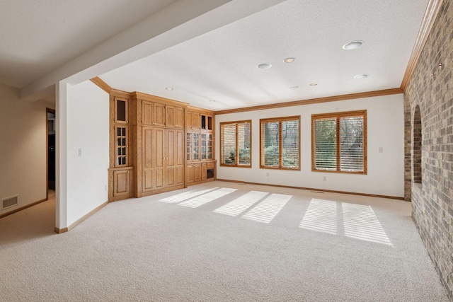 4 Antrim Ter, Edina, MN 55439 - unfurnished room featuring ornamental molding, visible vents, light carpet, brick wall, and baseboards