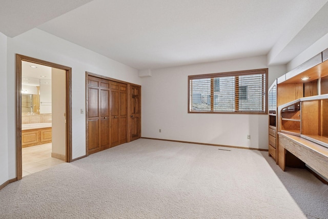 4 Antrim Ter, Edina, MN 55439 - unfurnished bedroom with light carpet, baseboards, and connected bathroom