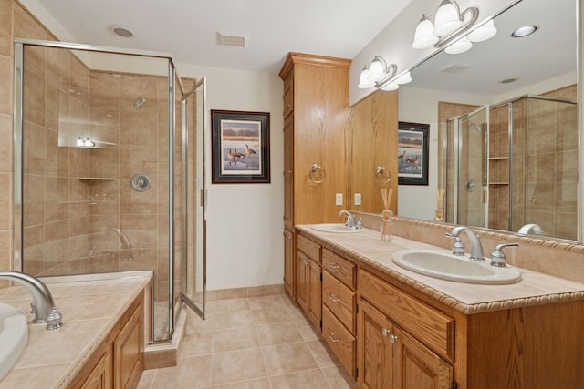 4 Antrim Ter, Edina, MN 55439 - bathroom featuring visible vents, a sink, and a stall shower