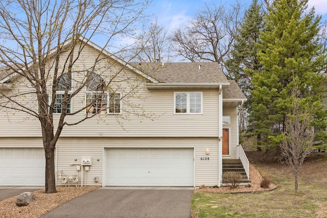 6108 Creek Line Dr, Minnetonka, MN 55345 - view of front of home with roof with shingles, an attached garage, and aphalt driveway