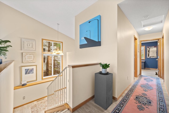 6108 Creek Line Dr, Minnetonka, MN 55345 - corridor featuring baseboards, wood finished floors, and an upstairs landing