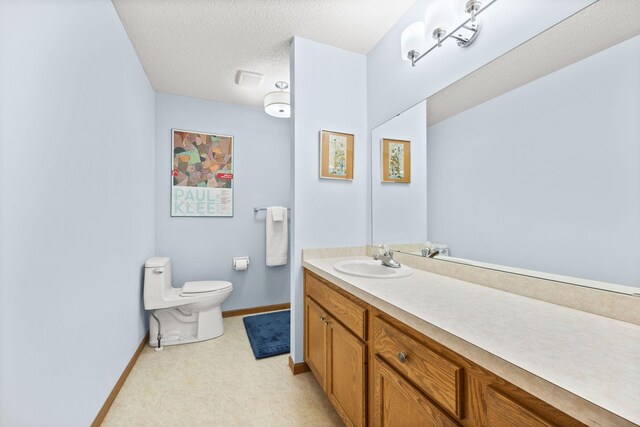 6108 Creek Line Dr, Minnetonka, MN 55345 - bathroom featuring toilet, a textured ceiling, vanity, and baseboards
