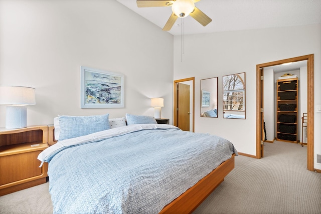 6108 Creek Line Dr, Minnetonka, MN 55345 - bedroom with a ceiling fan, carpet, baseboards, lofted ceiling, and a spacious closet