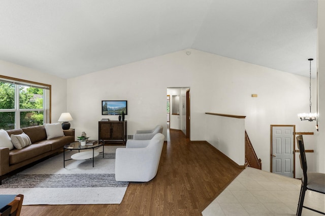 2294 Mathias Rd, Shakopee, MN 55379 - living area featuring wood finished floors, vaulted ceiling, and a chandelier