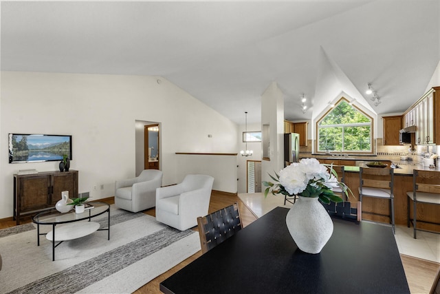 2294 Mathias Rd, Shakopee, MN 55379 - dining room featuring lofted ceiling and light wood-style flooring