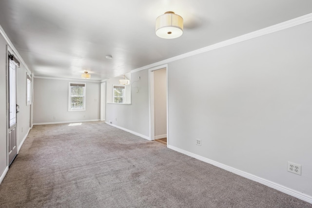 3511 Mckinley St NE, Minneapolis, MN 55418 - carpeted empty room with baseboards and ornamental molding