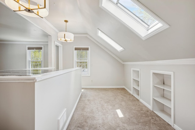 3511 Mckinley St NE, Minneapolis, MN 55418 - bonus room with built in features, a skylight, carpet flooring, vaulted ceiling, and baseboards